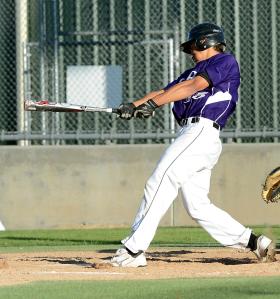 Nolan drives in a run at a 2013 AA American Legion game.